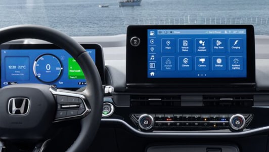 Close-up of the infotainment system in a Honda vehicle displaying Google Built-In