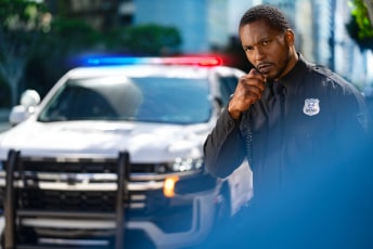 A police officer arrives at a scene thanks to OnStar's vehicle mobile app.