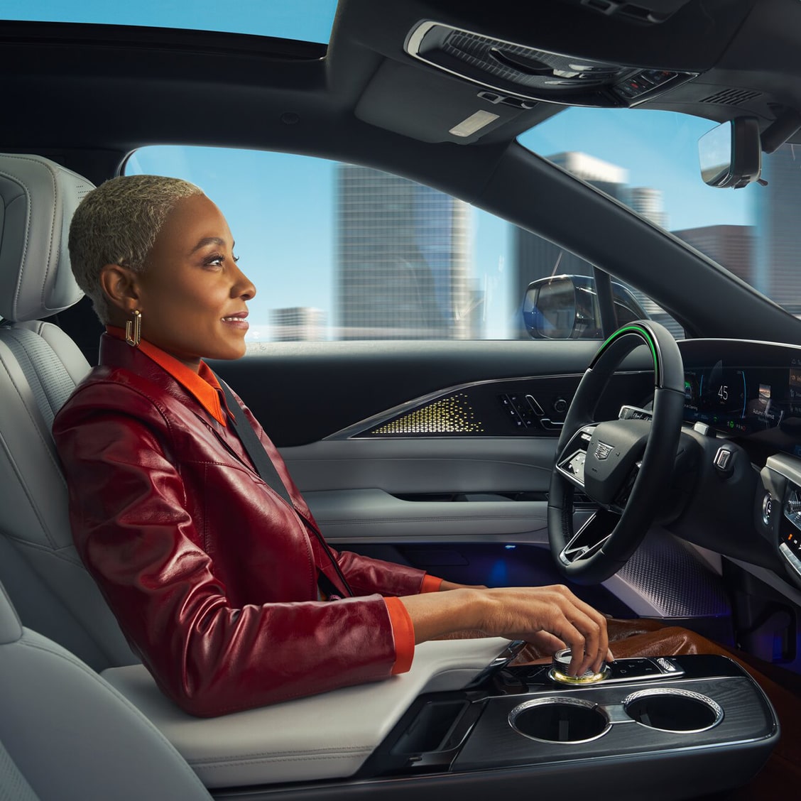 A woman using the Super Cruise feature in her GM vehicle.