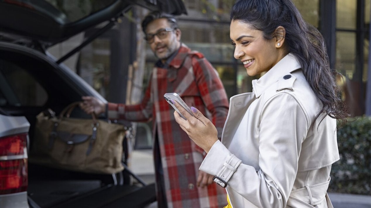 A couple using OnStar Guardian App.