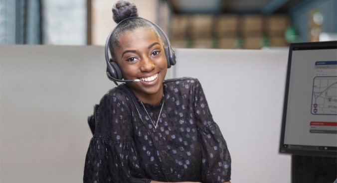 Female OnStar Advisor Smiling with Headset on